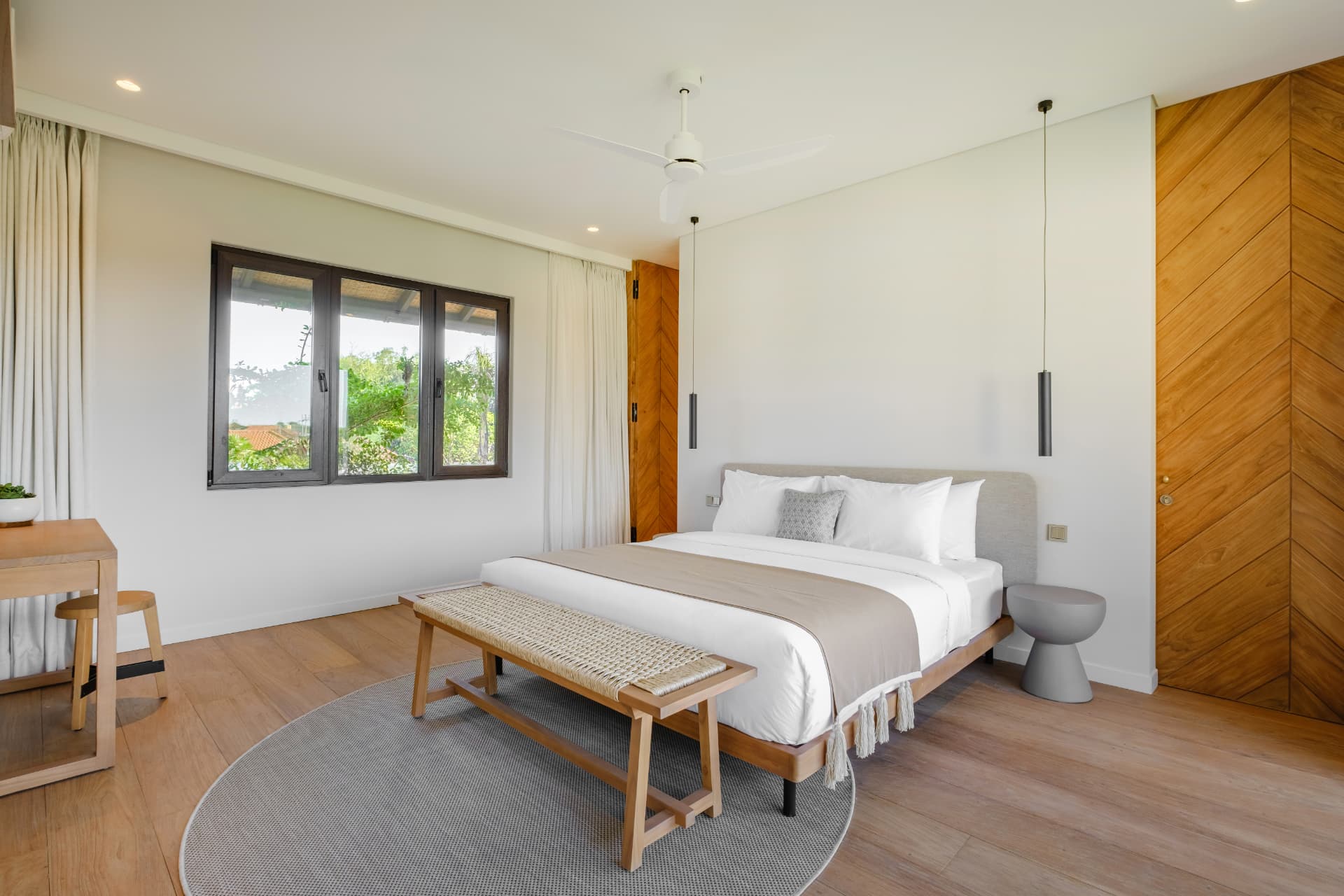 Villa Uni — bedroom with chevron teak wall and oak flooring