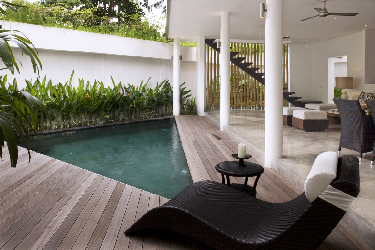 Courtyard pool with timber deck and white colonnade