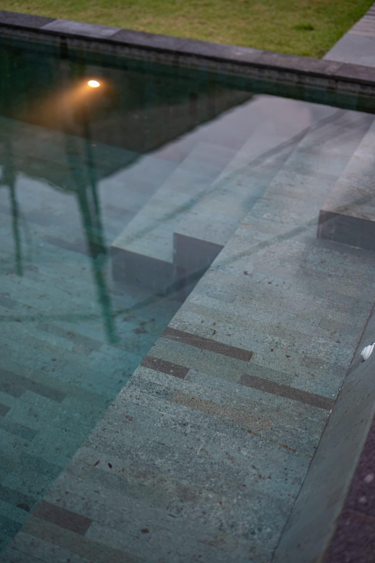 Stone pool edge and submerged steps