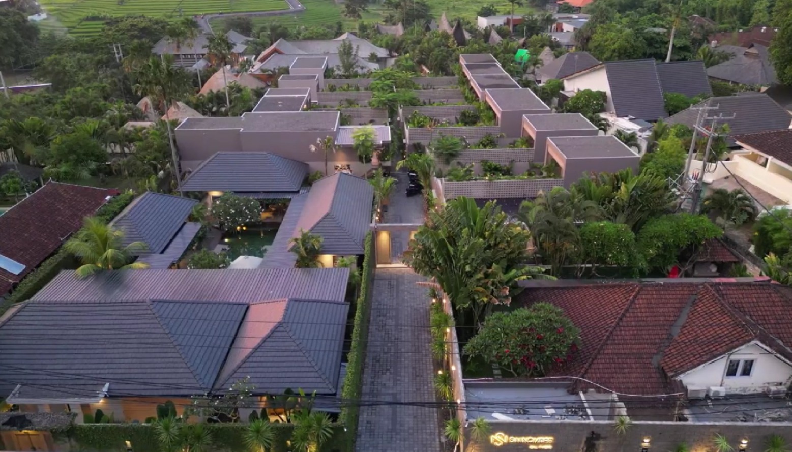 Sin Nombre Bali — aerial view of the villa cluster at dusk