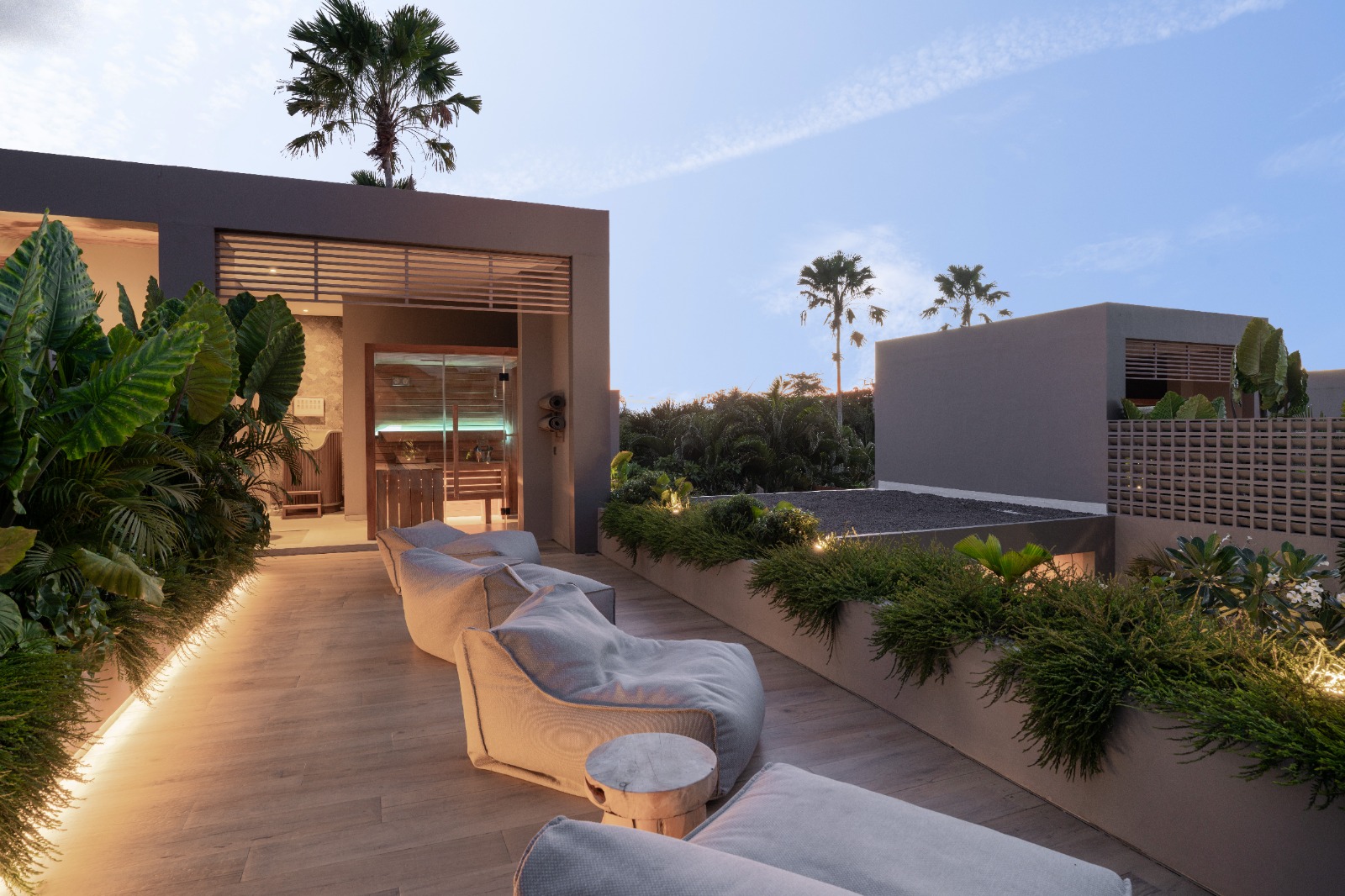 Sin Nombre Bali — rooftop lounge terrace with sauna at dusk