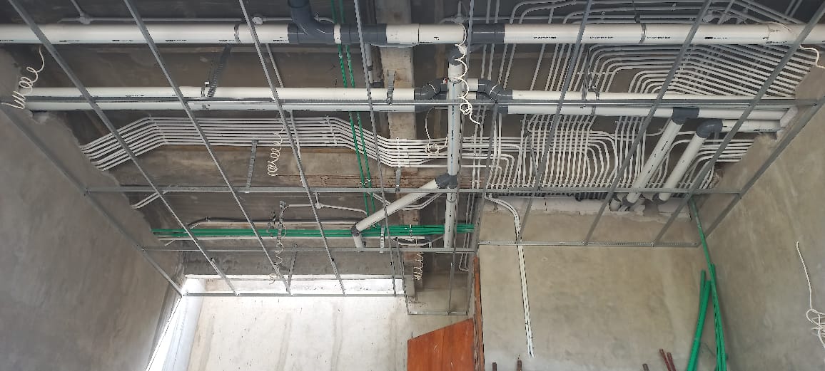 Ceiling with electrical and plumbing conduit installations
