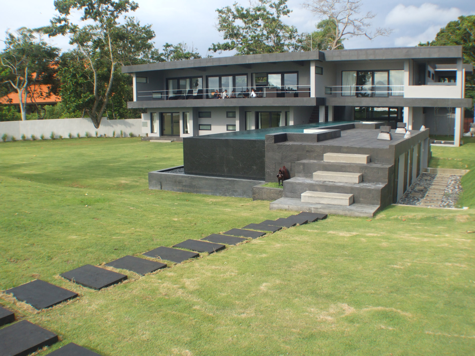 Two-storey concrete residence with an elevated infinity pool