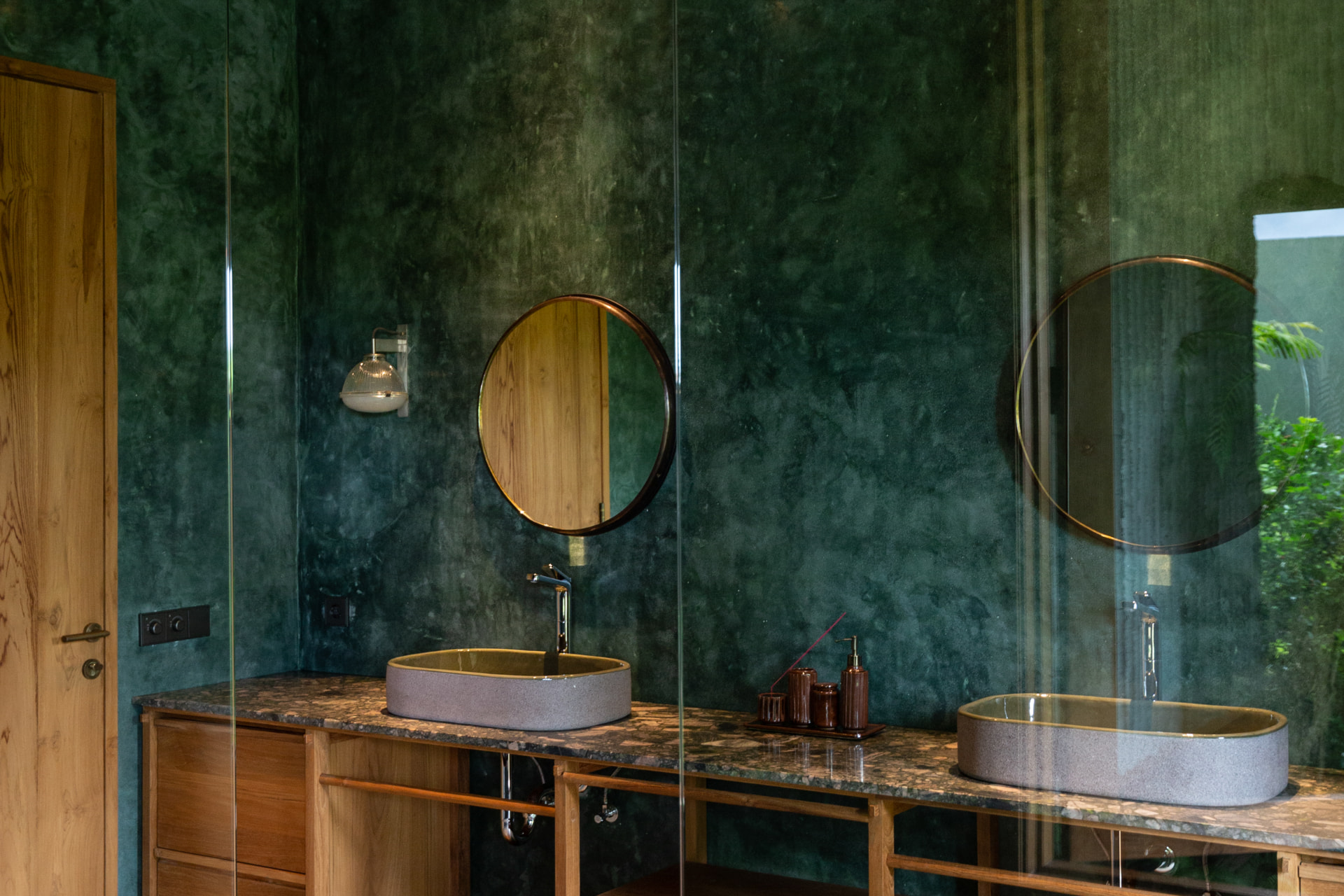 Ubud 1 — master ensuite with green polished plaster and twin stone basins
