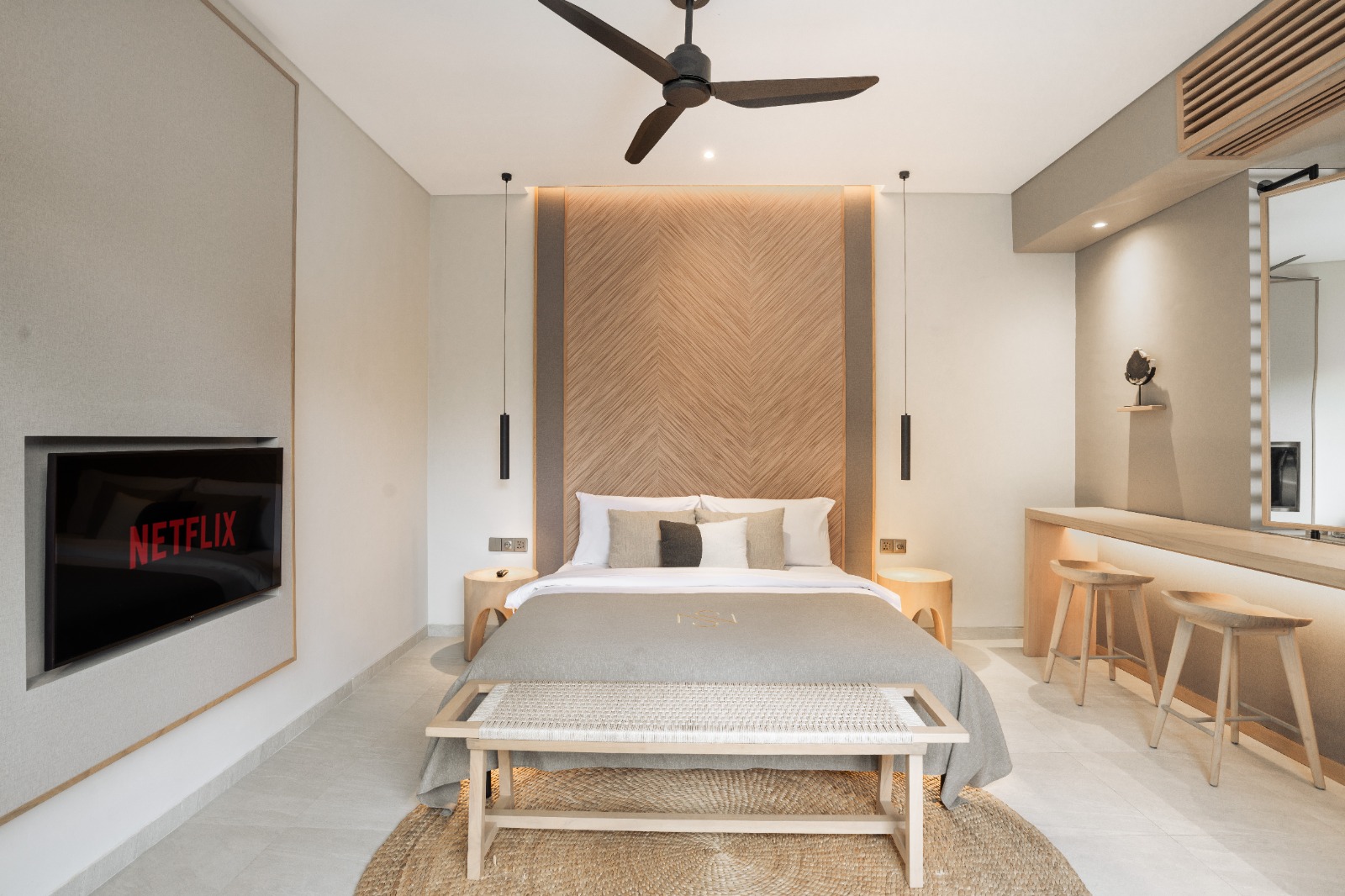 Bedroom with herringbone timber headboard