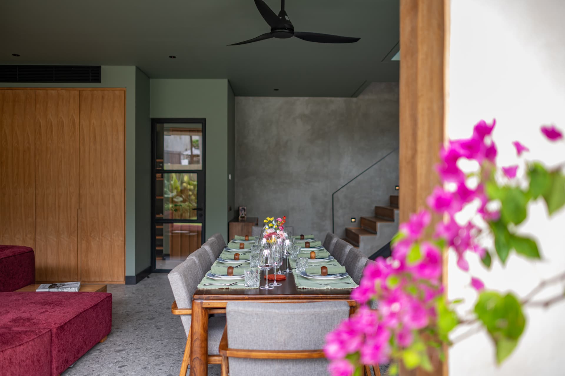 Dining table with timber joinery and plaster walls