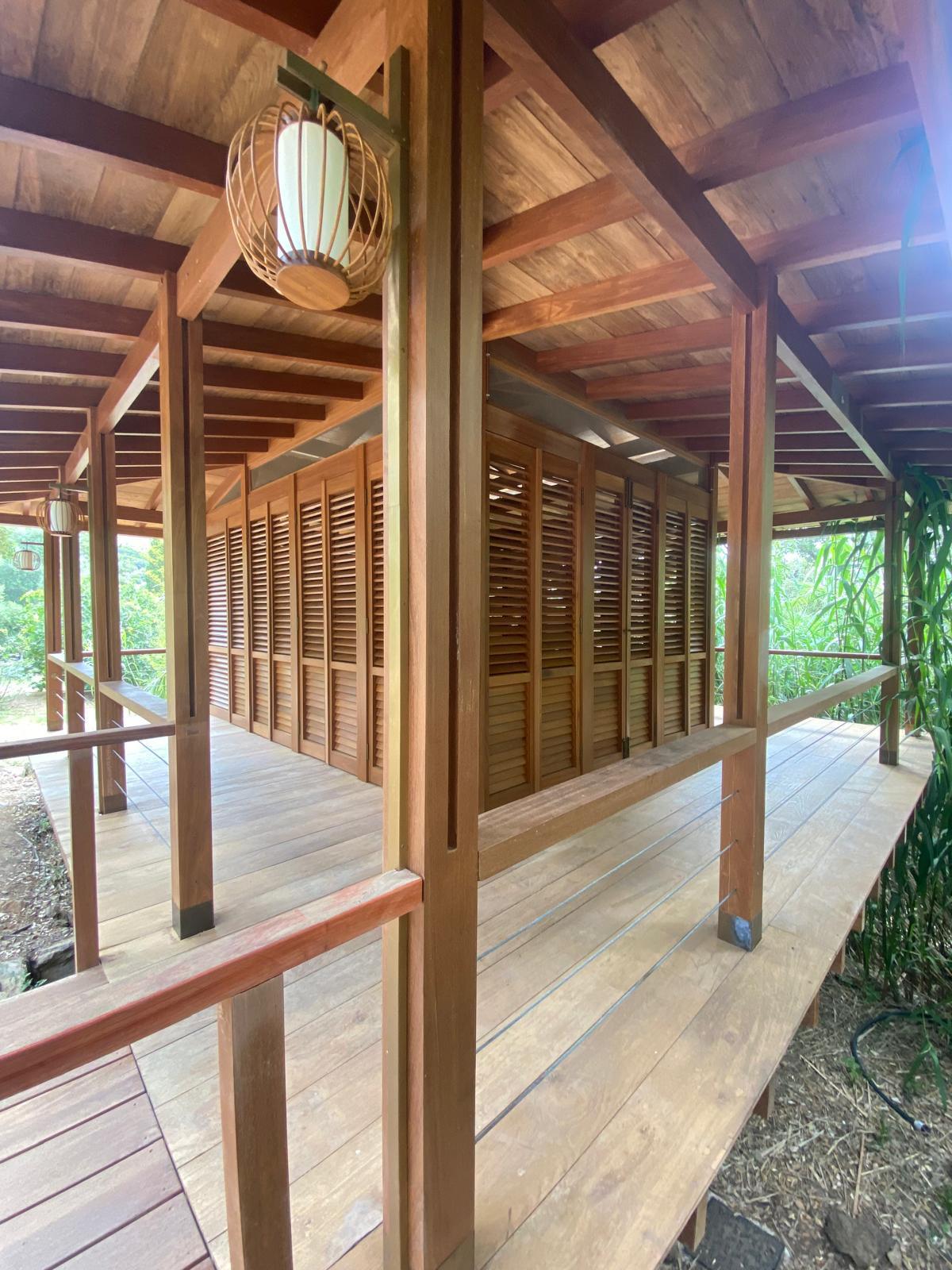 Tea House — deck and veranda with hardwood posts and lantern
